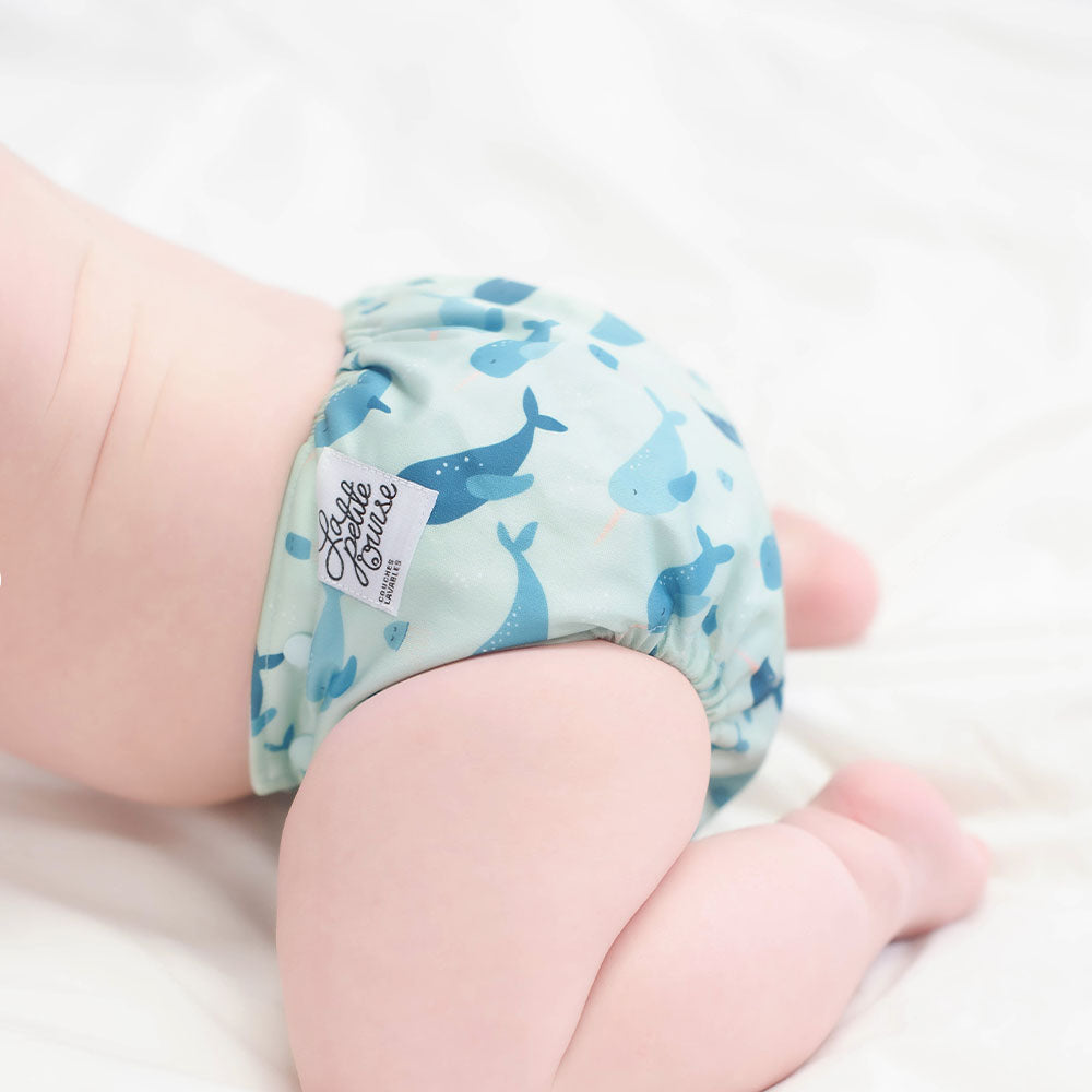 The Cloth Nappy Company Malta La Petite Ourse Pocket narwhal on baby